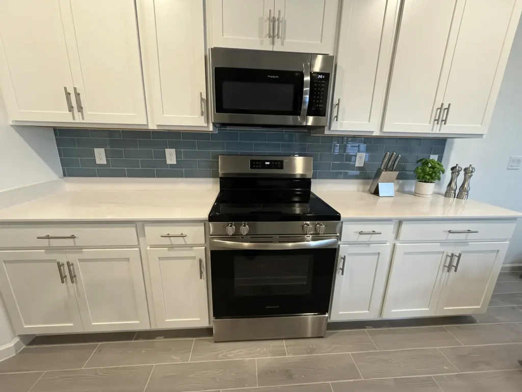 Blue glass subway tile kitchen backsplash