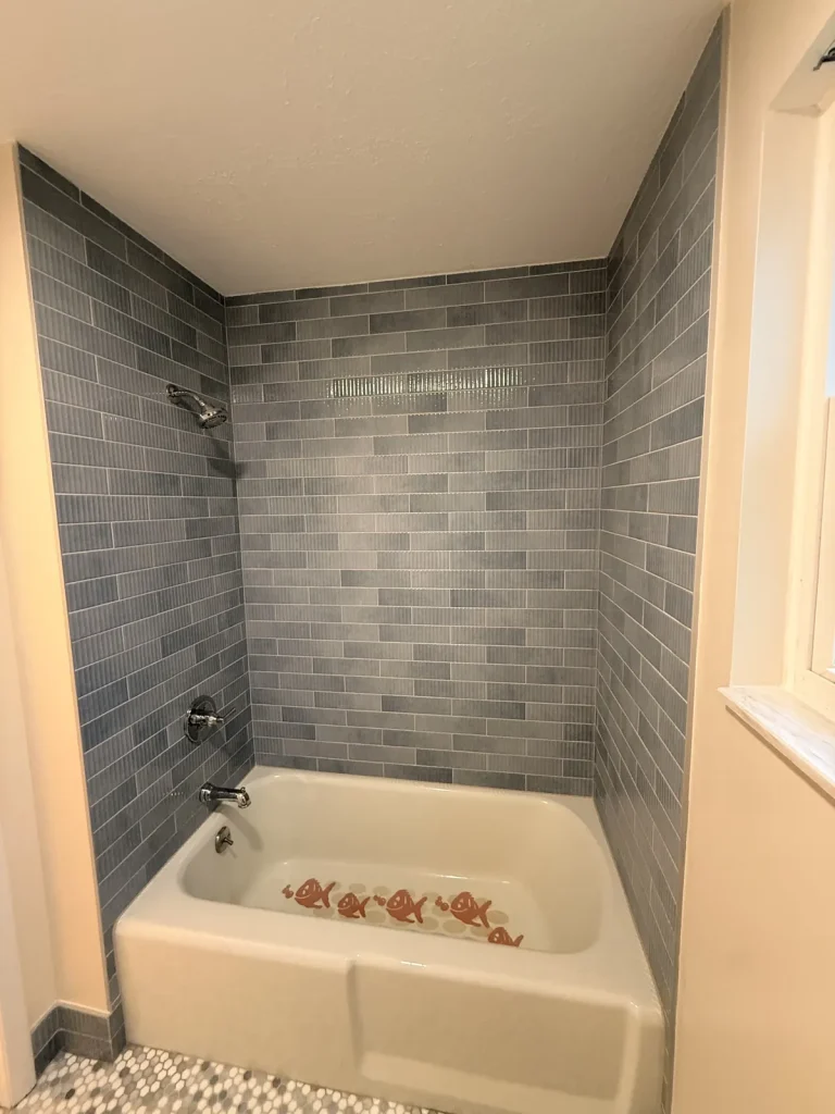 Blue ceramic subway tile shower wall