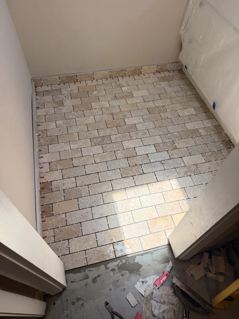 Travertine-look bathroom floor tile