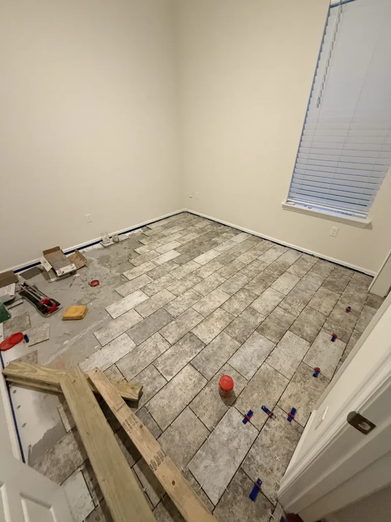 Plank tile floor installation in progress