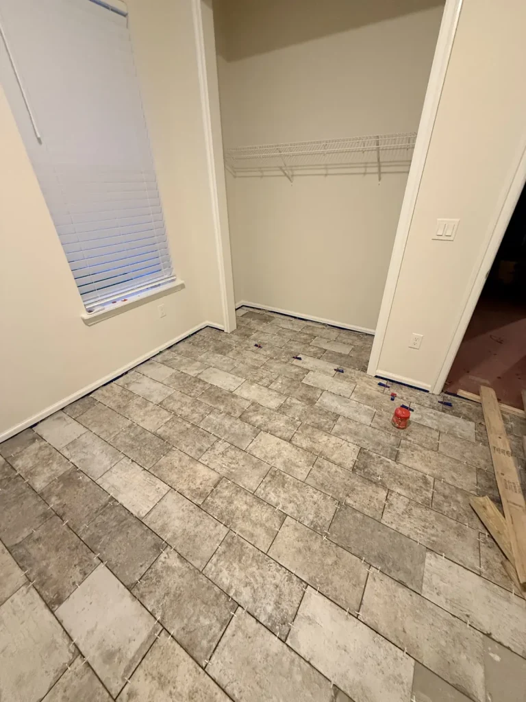 Plank porcelain floor tile installed in a bedroom