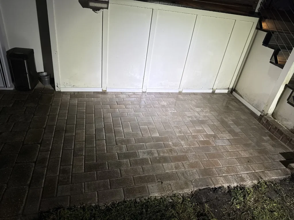 Paver grill pad under a deck