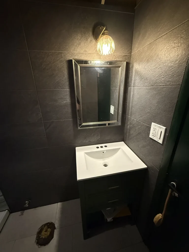 Slate-look tile bathroom with vanity